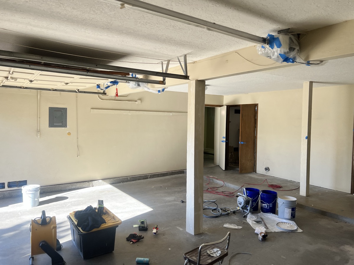 Cracked bare concrete garage floor before professional epoxy coating in Albuquerque NM